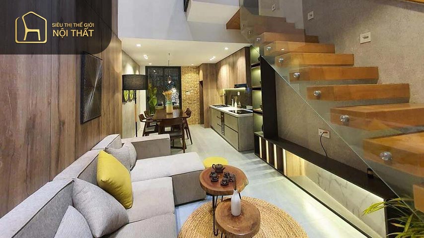 Mẫu phòng khách đẹp có cầu thang gỗ có màu sắc tương phản với màu căn phòng tạo sự nổi bật